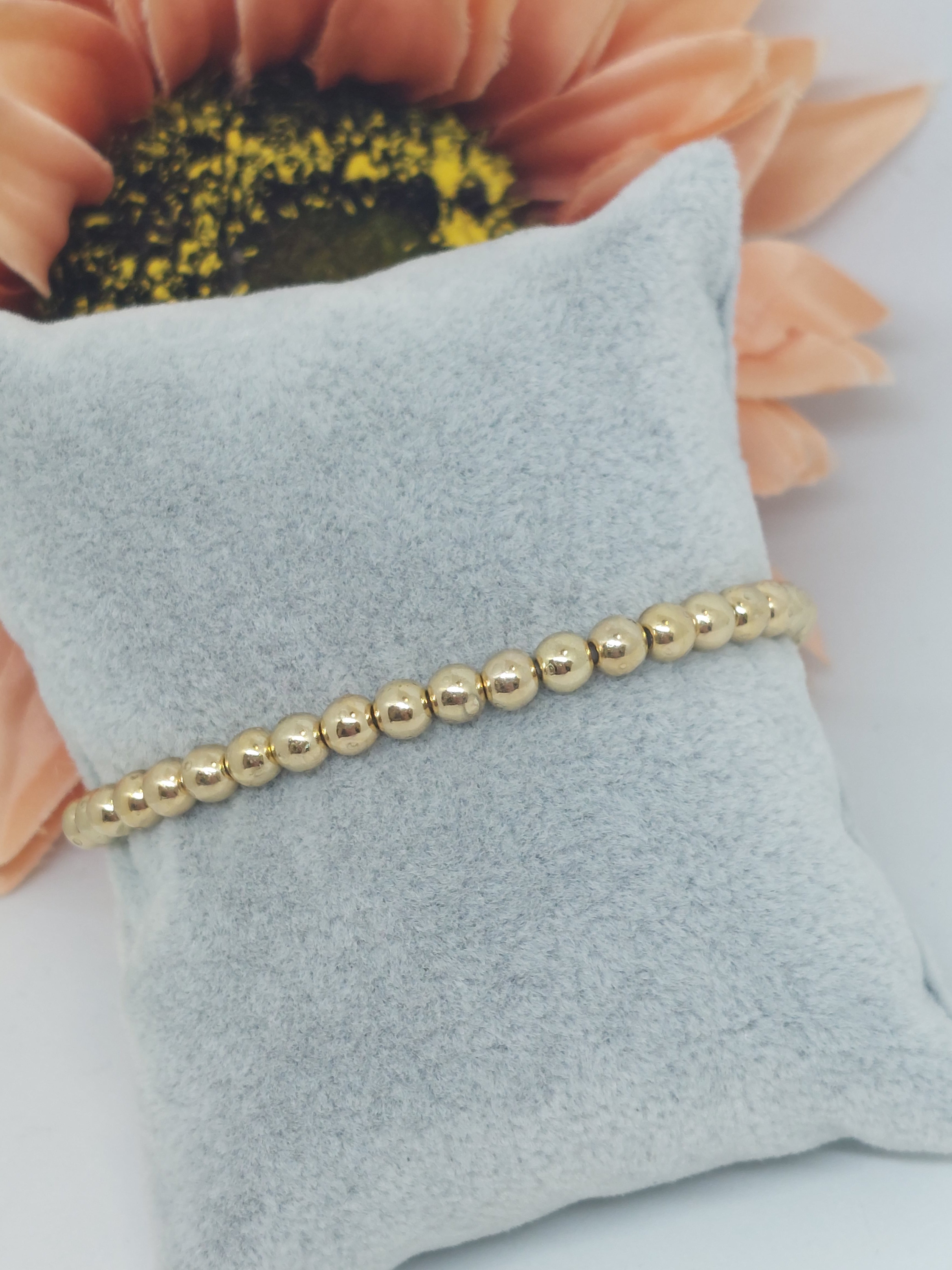 Armbandje balls goudkleurig (RVS)