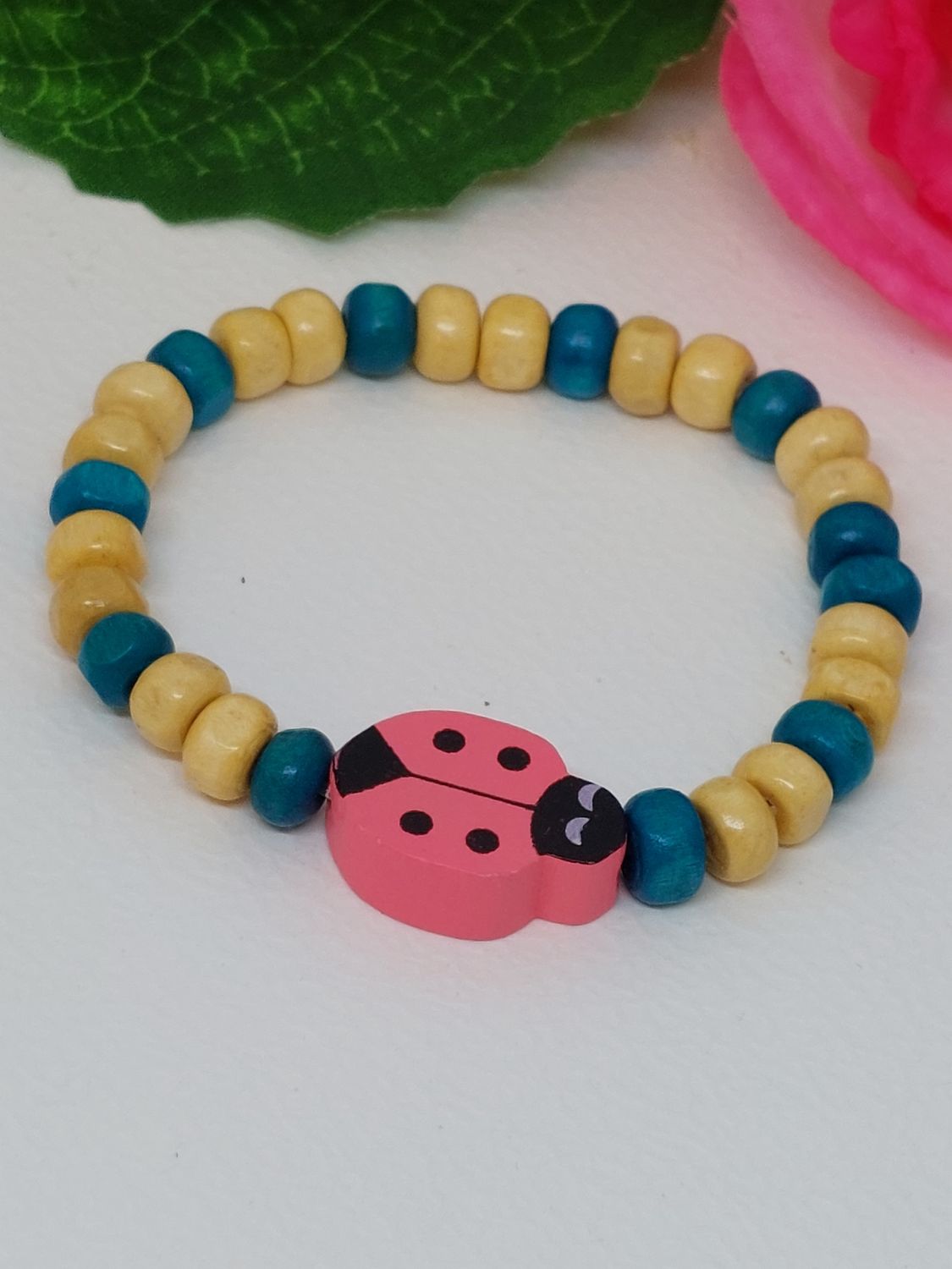 Lieveheersbeestje donker roze met blauw