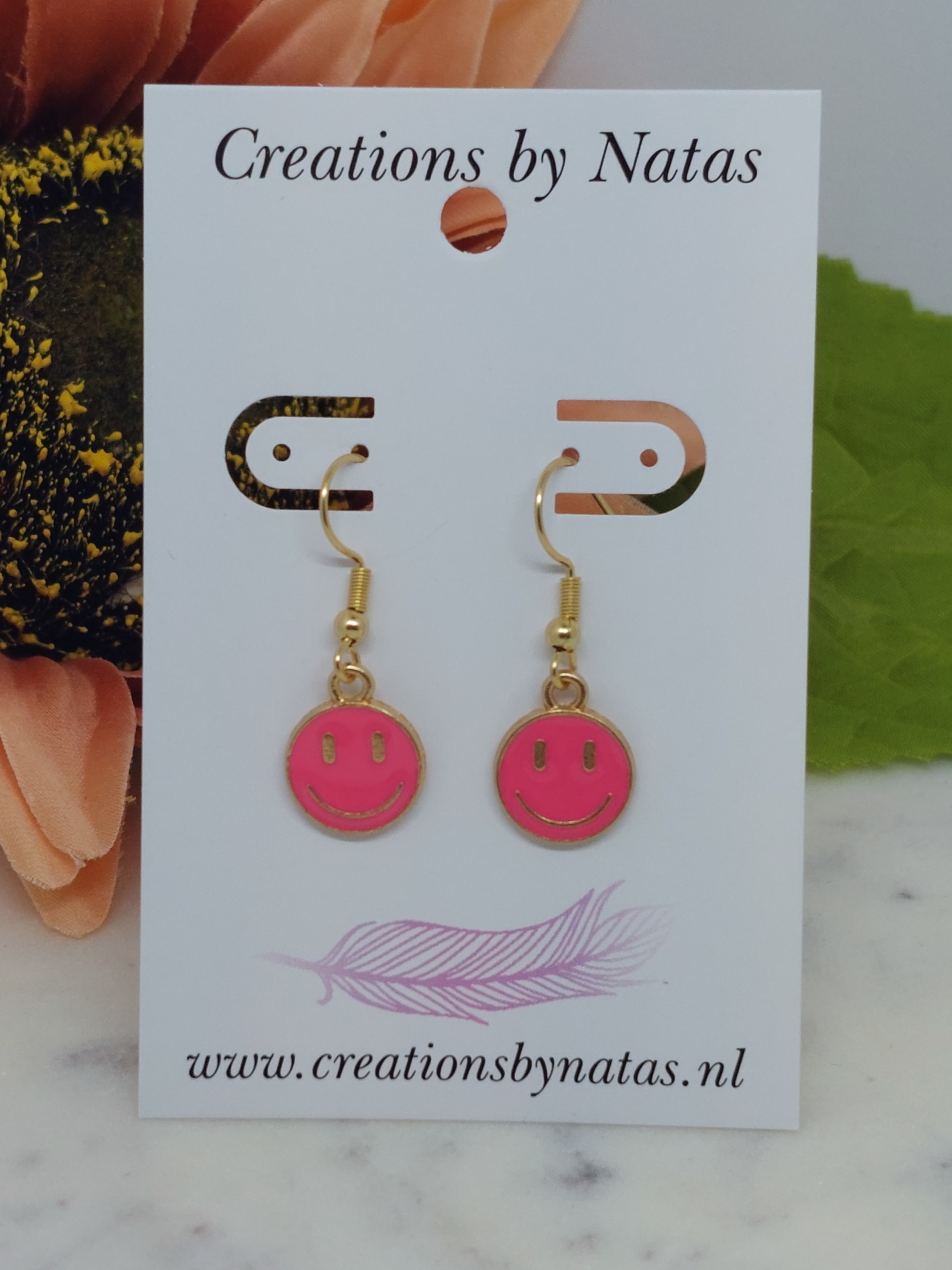 Oorbel smiley roze