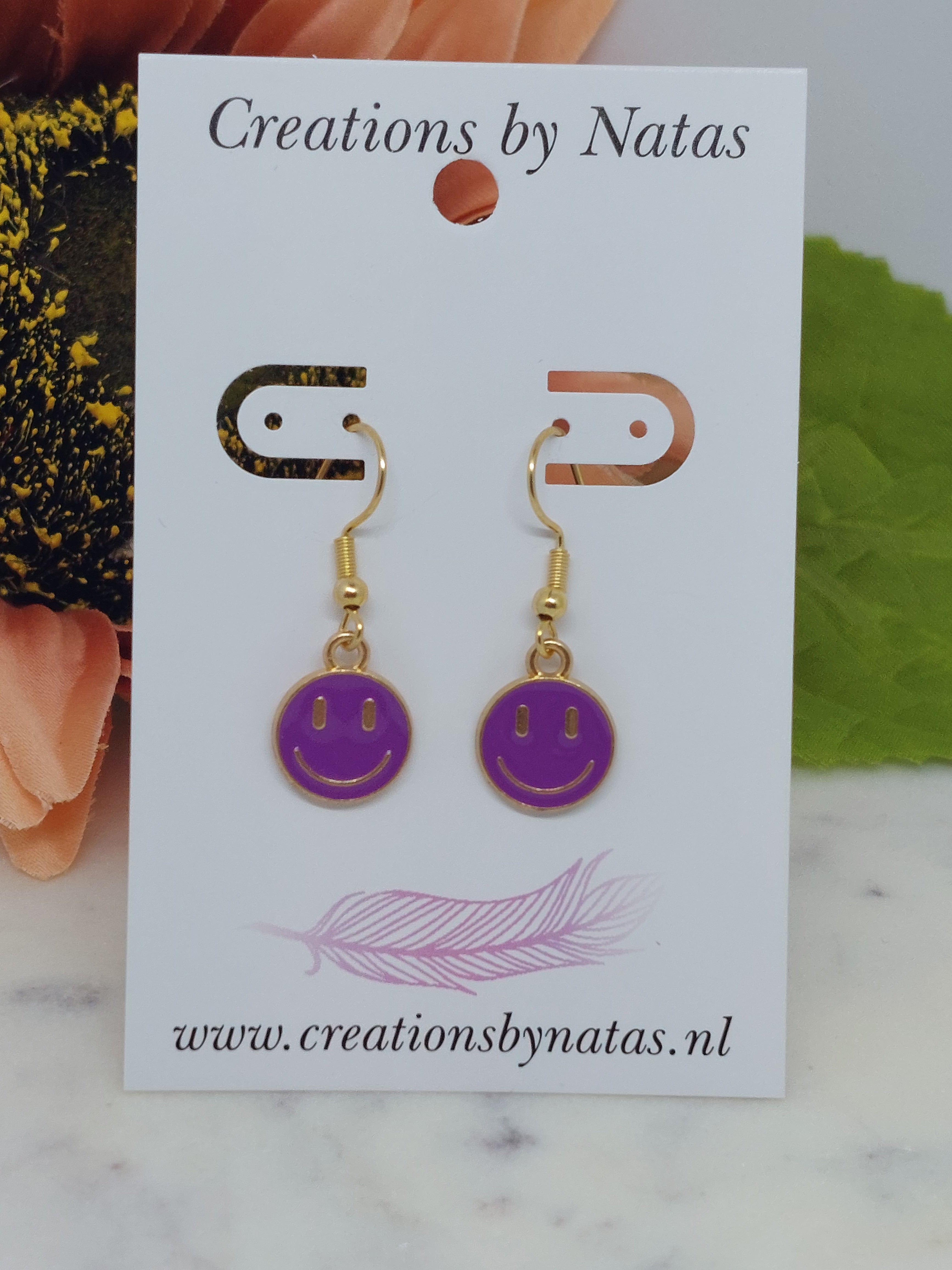 Oorbel smiley paars