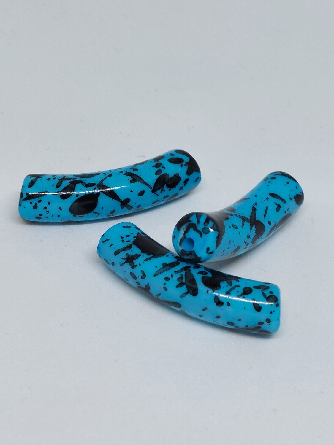 Tube kraal Verfspetter aqua blauw/zwart